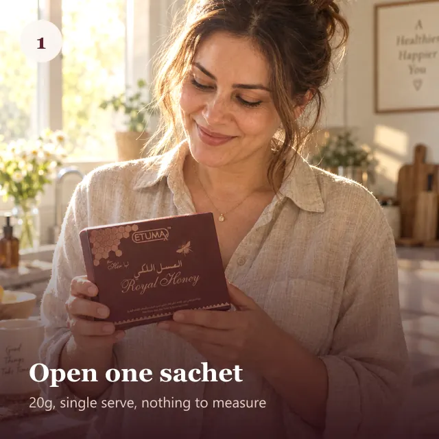 A woman opening a box of Etumax Royal Honey For Her